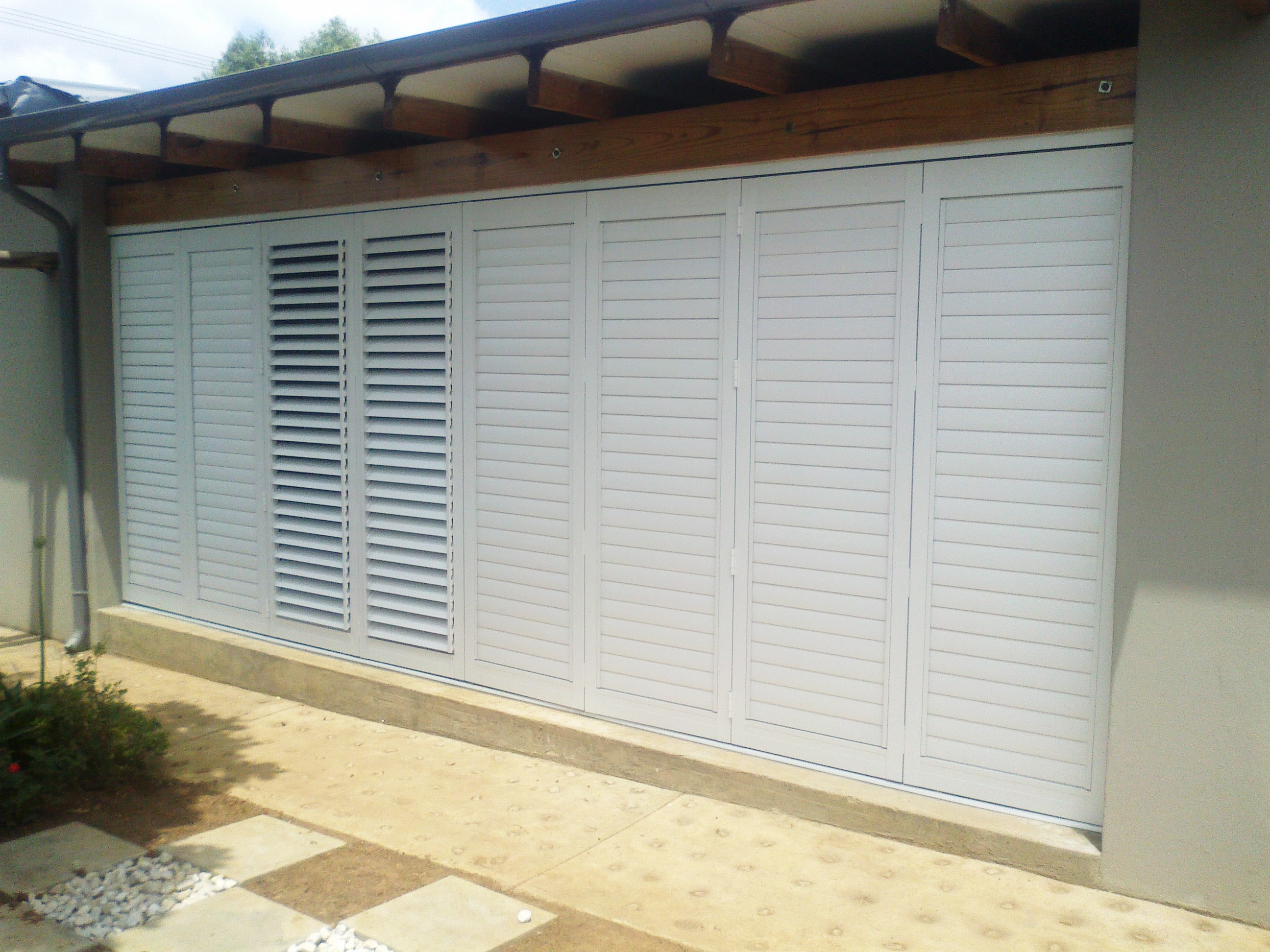 Basswood adjustable shutters for sun projects that display the product for blinds awnings and patios